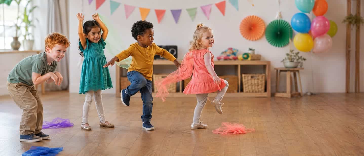 Children freezing mid-dance with scarves during a freeze dance party
