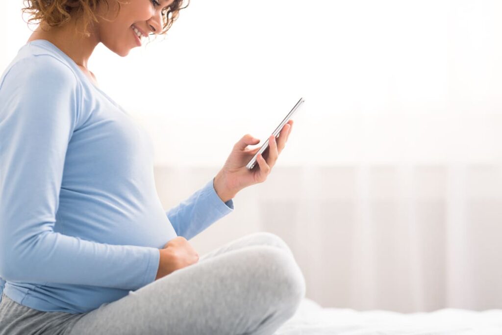 pregnancy apps concept expectant woman using cell 2021 08 30 02 21 39 utc