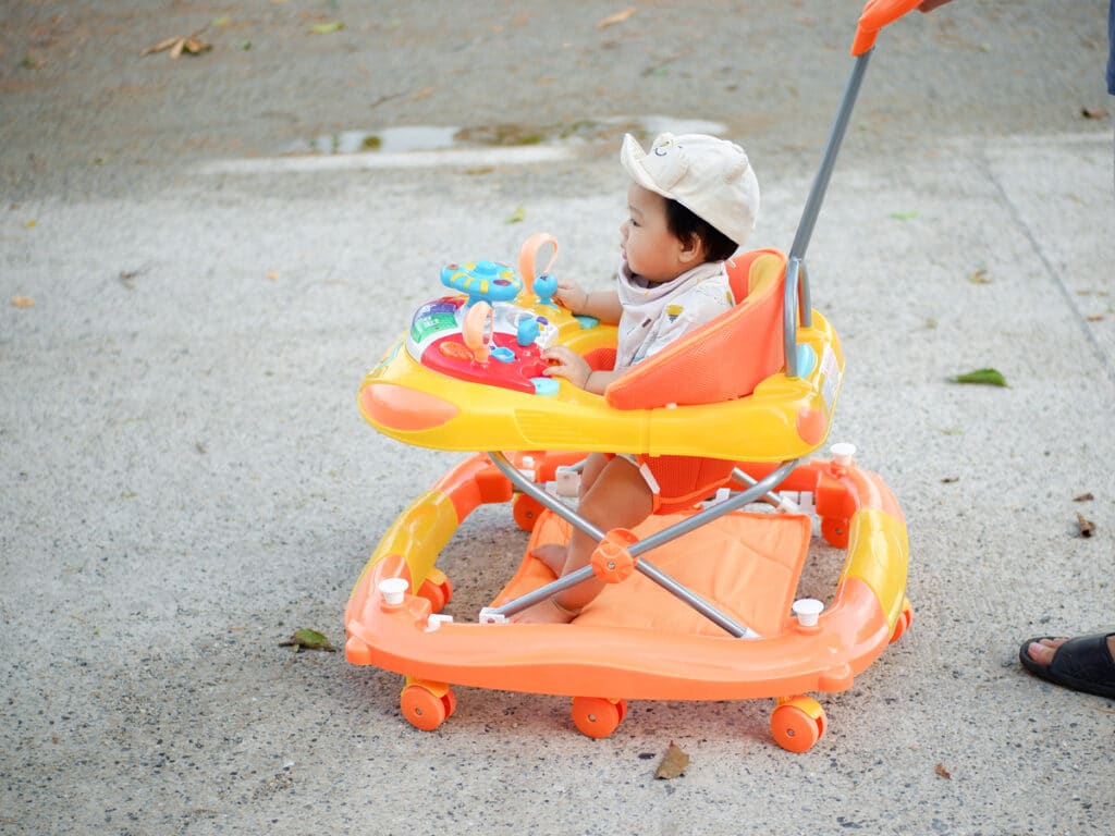 baby in the yard in a walker little boy sitting in 2021 09 03 10 44 59 utc(1)