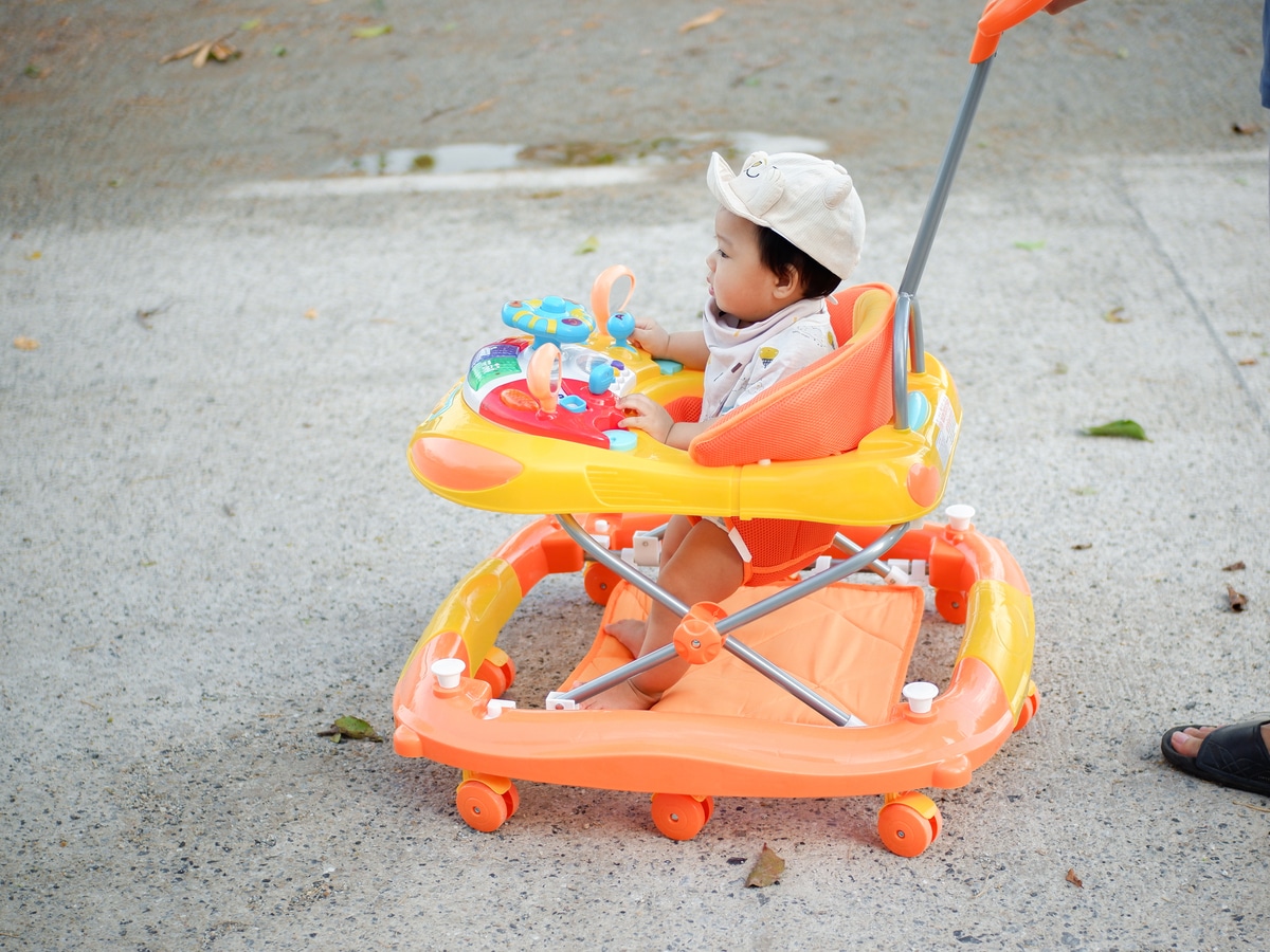 baby in the yard in a walker little boy sitting in 2021 09 03 10 44 59 utc(1)