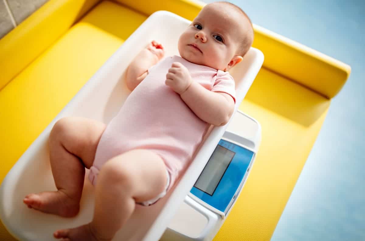 beautiful newborn baby on weighing scale health 2021 08 30 13 44 53 utc