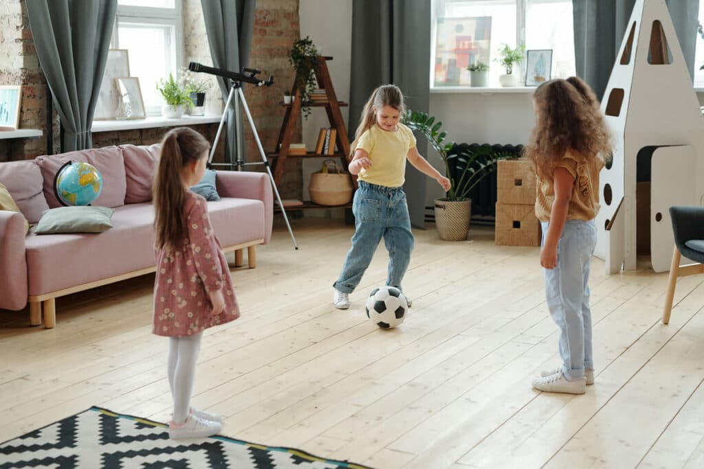 kids playing football on the floor of living room 2021 09 24 03 44 20 utc