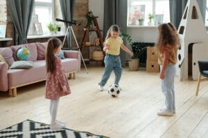 kids playing football on the floor of living room 2021 09 24 03 44 20 utc