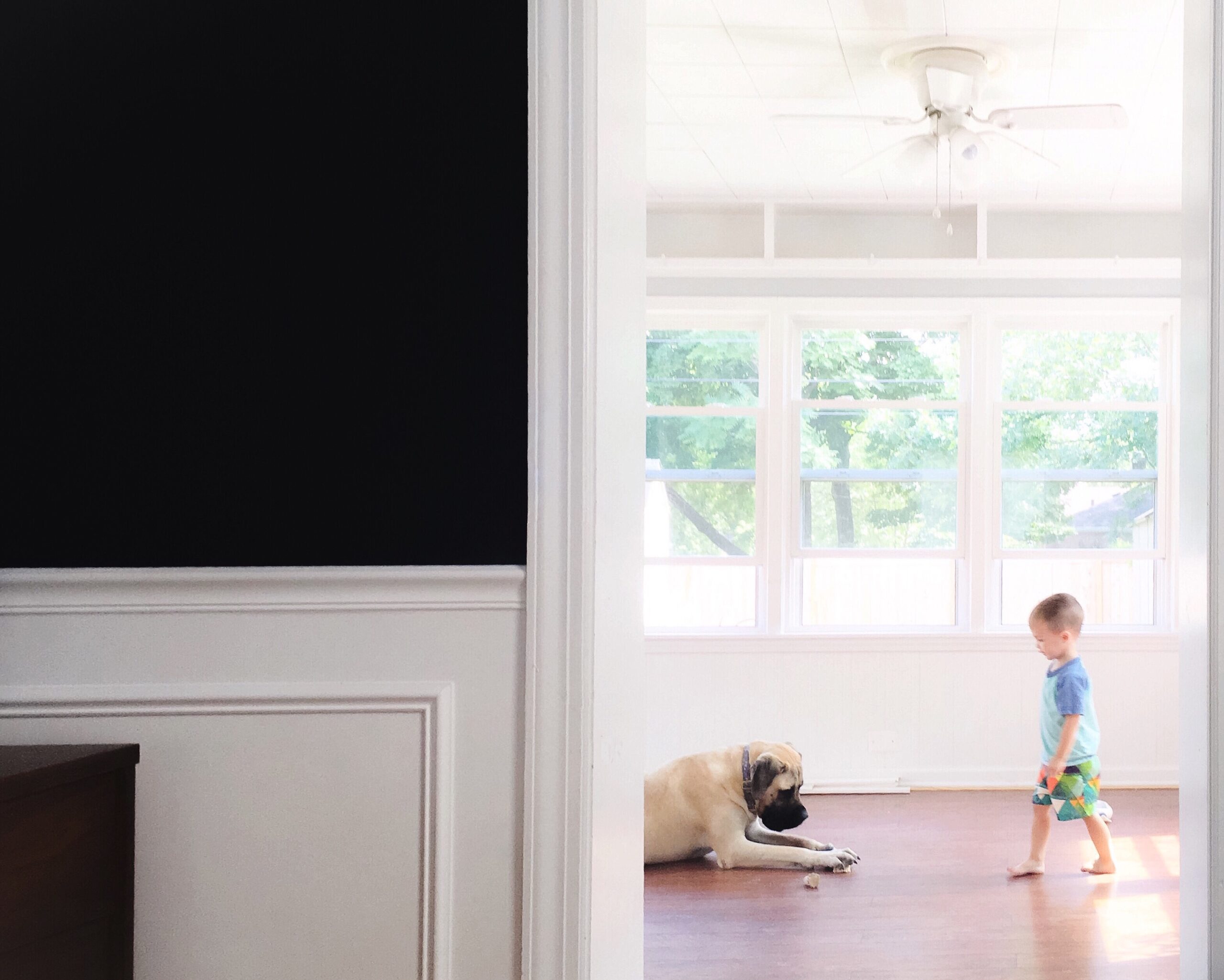 looking through a doorway at a young toddler boy a 2022 03 05 01 19 46 utc