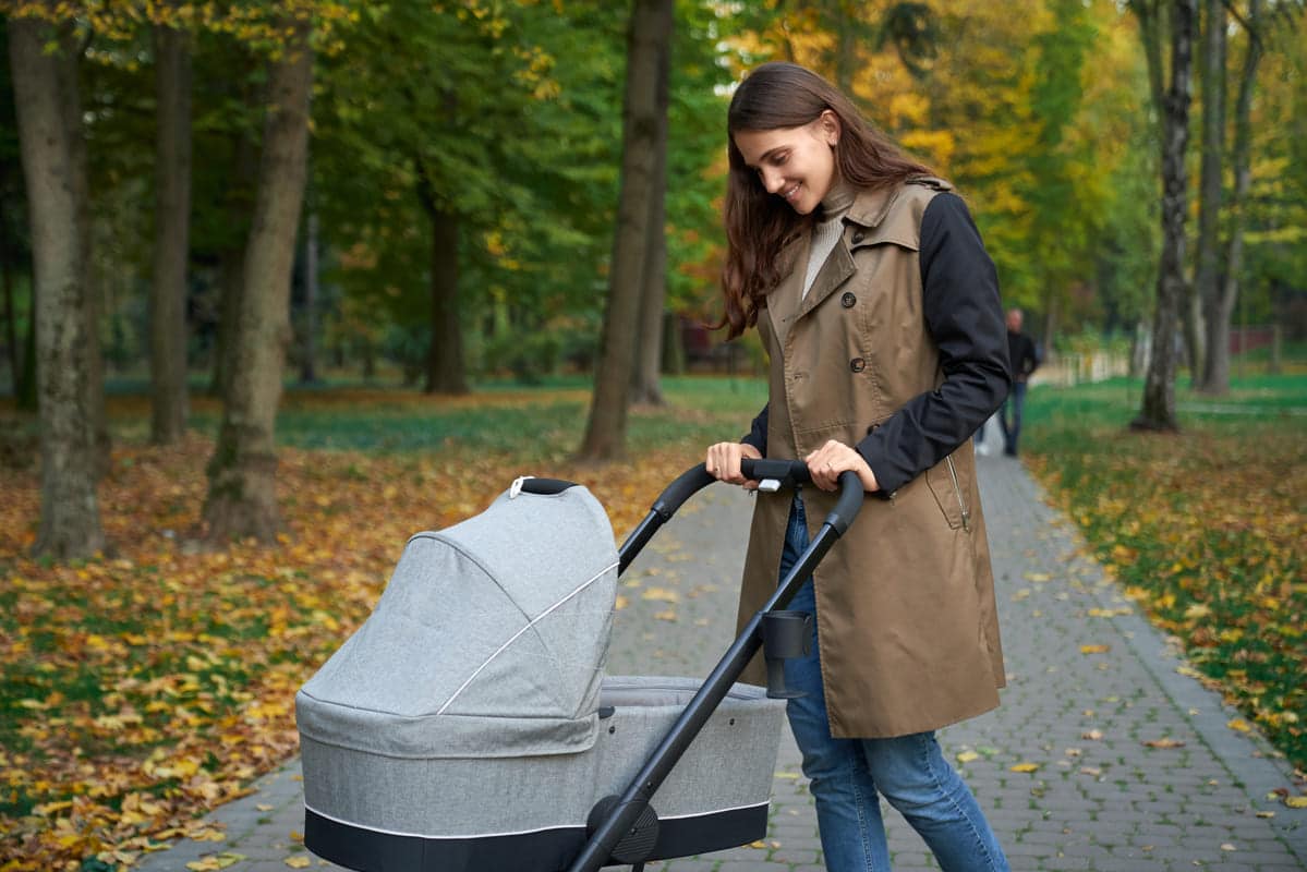 woman in grey coat standing with baby stroller 2021 08 29 09 41 24 utc(1)(1)