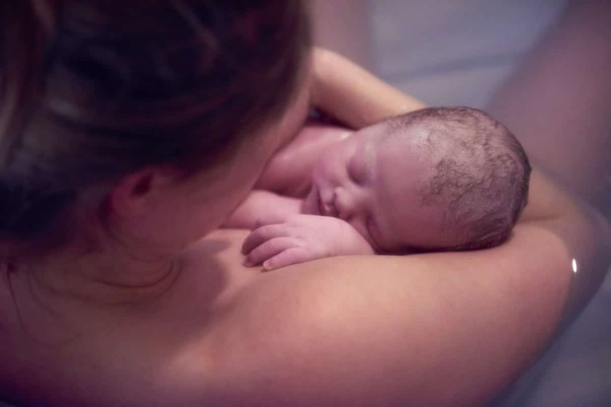 over shoulder portrait of young woman holding new 2022 03 04 01 52 00 utc