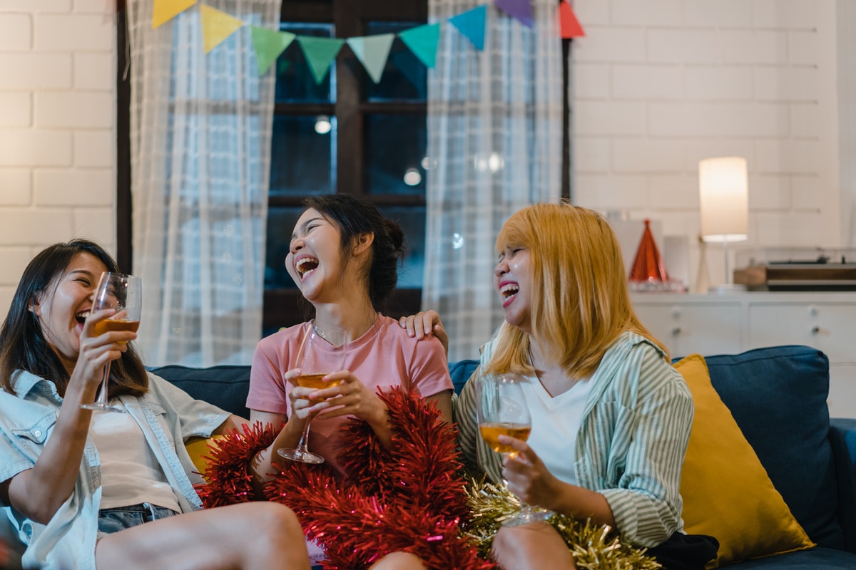 group of asian women party at home, female drinking cocktail tal