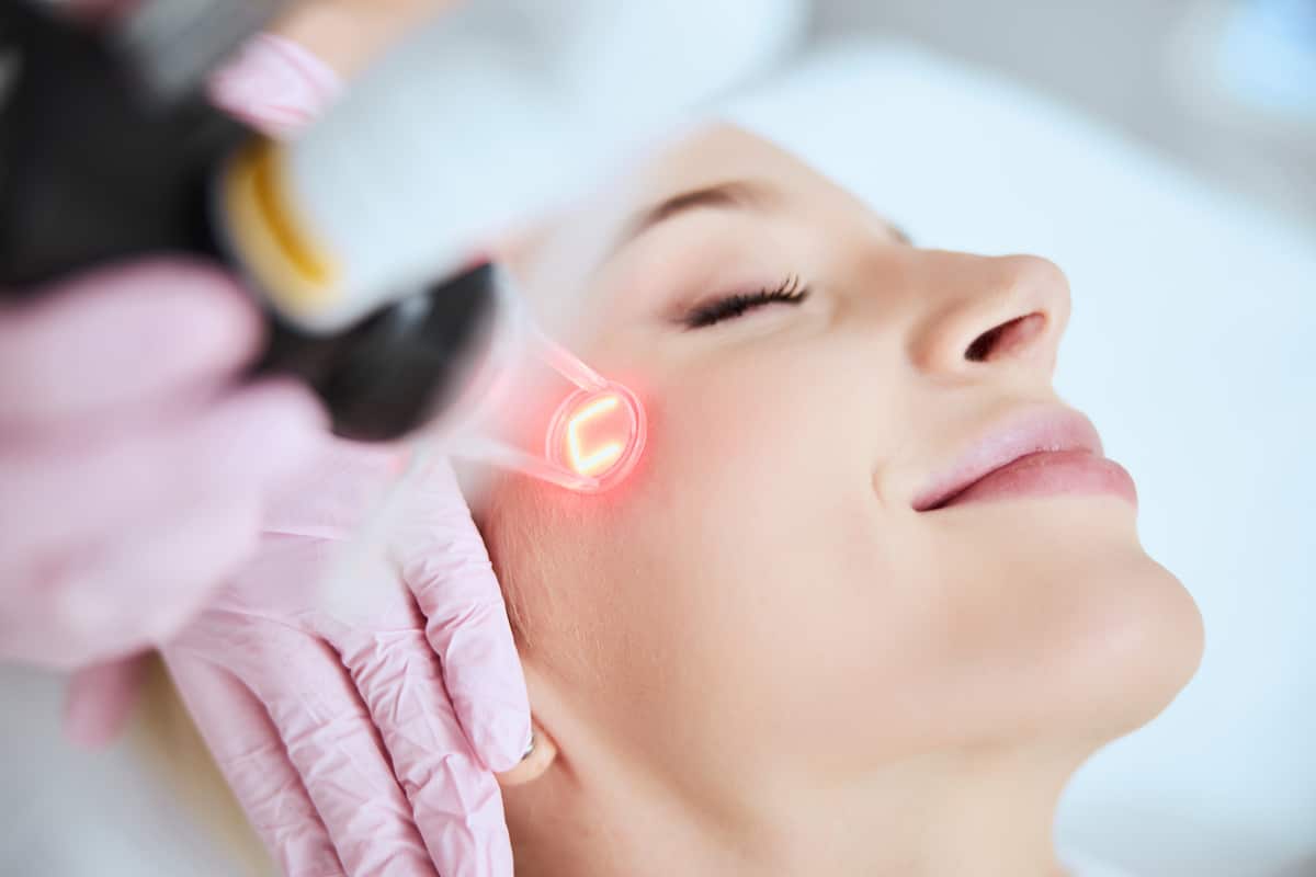 calm pleased lady undergoing a cosmetic procedure