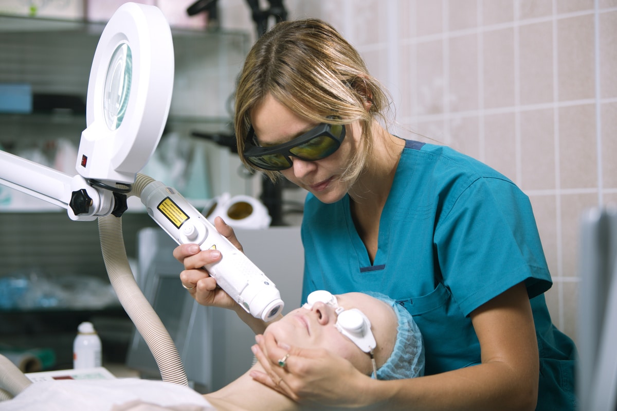 woman undergoing laser skin treatment