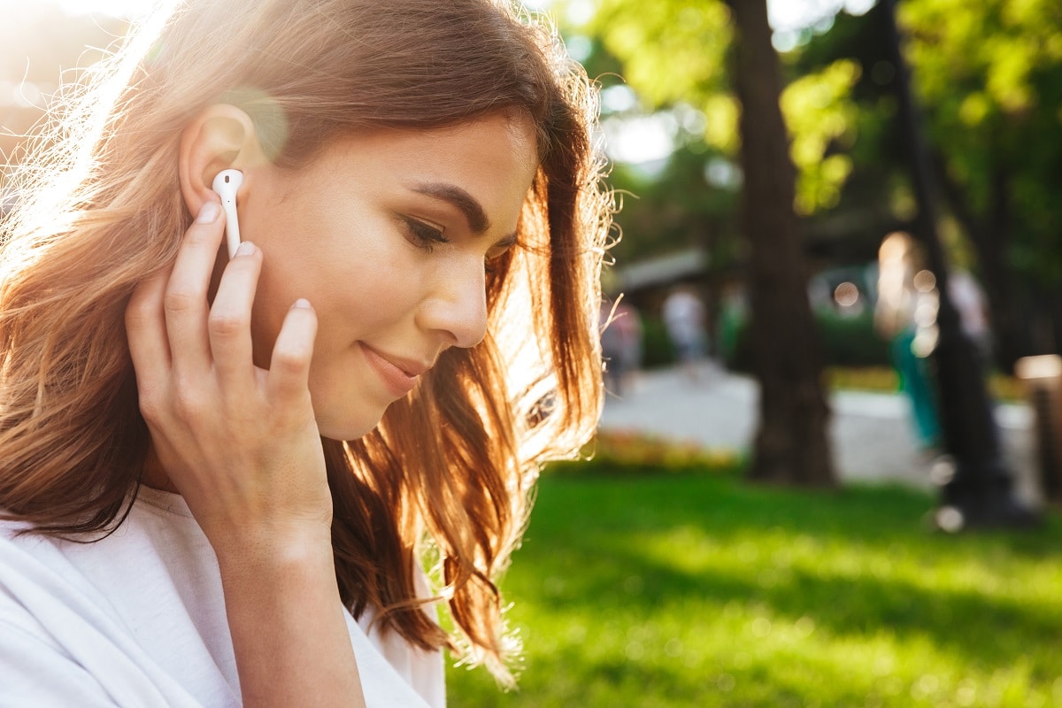 close up of a pretty young girl in earphones