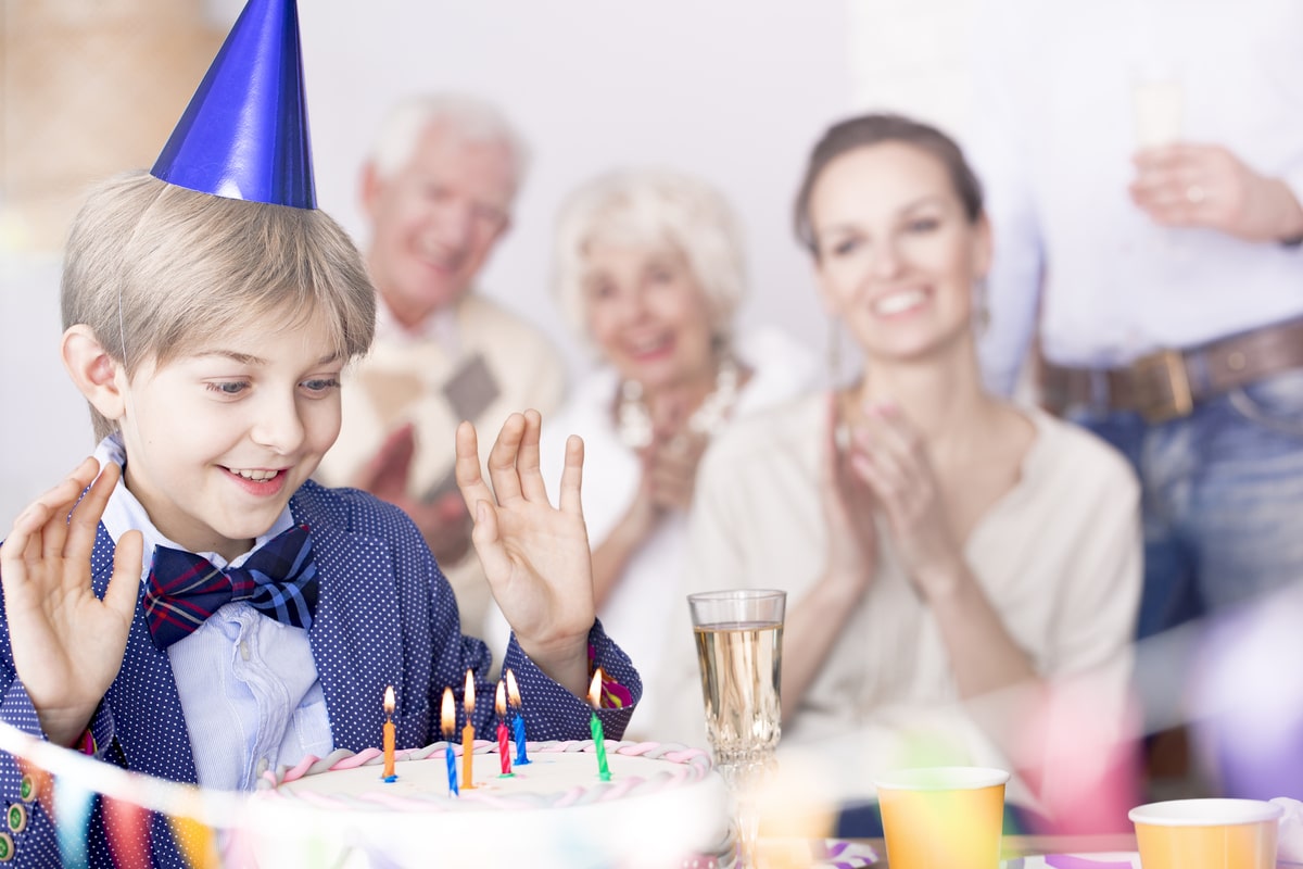 boy making birthday wish