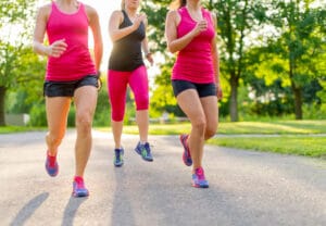 group of women jogging in nature