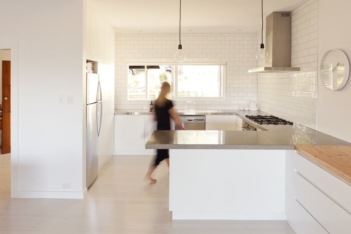 woman walking in kitchen