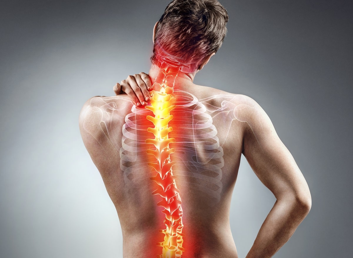 young man holding his neck in pain. medical concept.