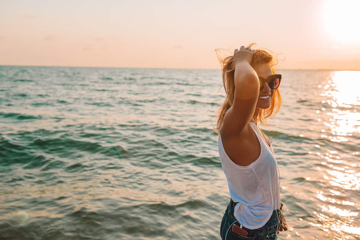 outdoor fashion portrait of stylish woman on the beach.