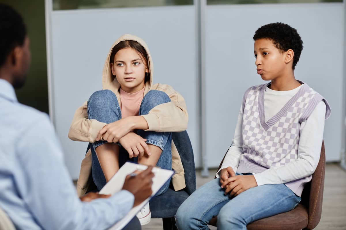 teenagers in therapy session