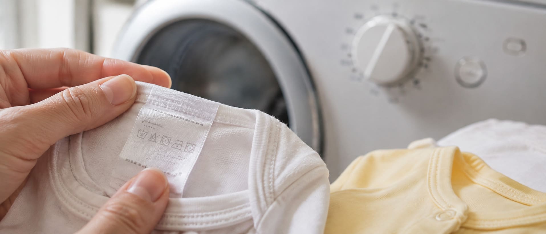 A clothing label checked before choosing water temperature and wash cycle