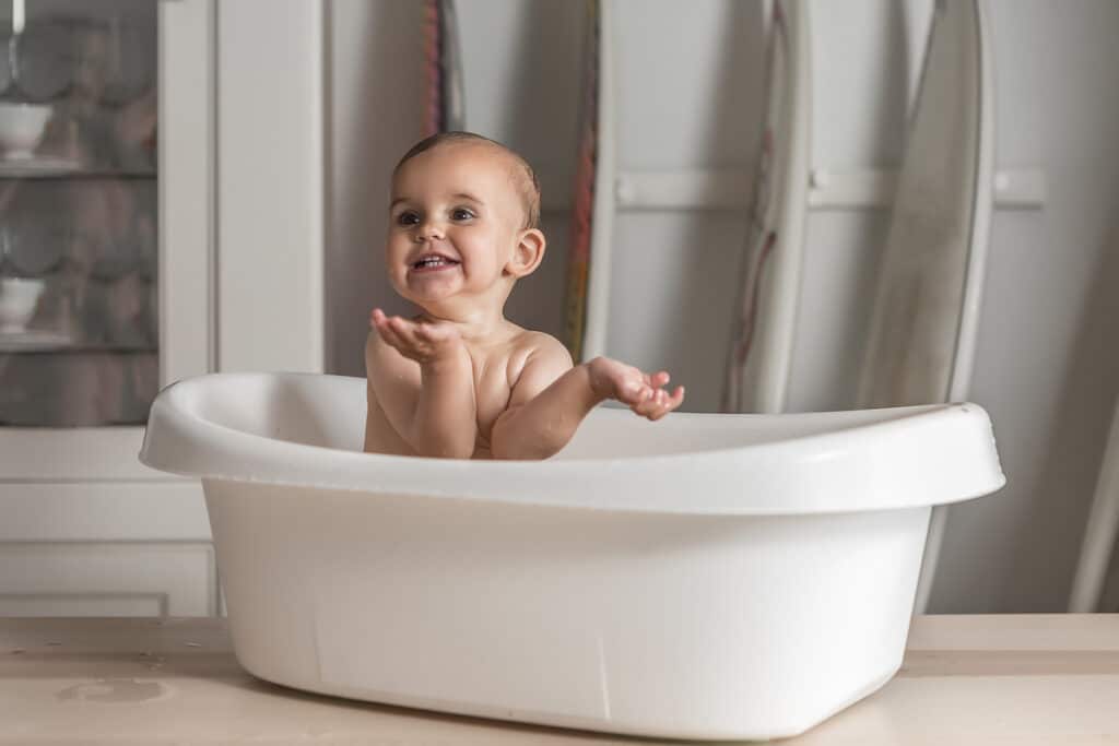 baby smiling in the bathtub