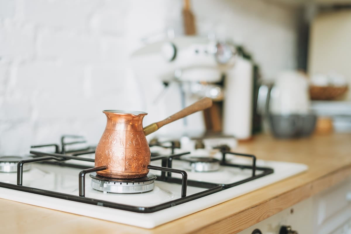 coffee copper pot on the stove at bright kitchen 2022 08 01 03 49 26 utc(1)