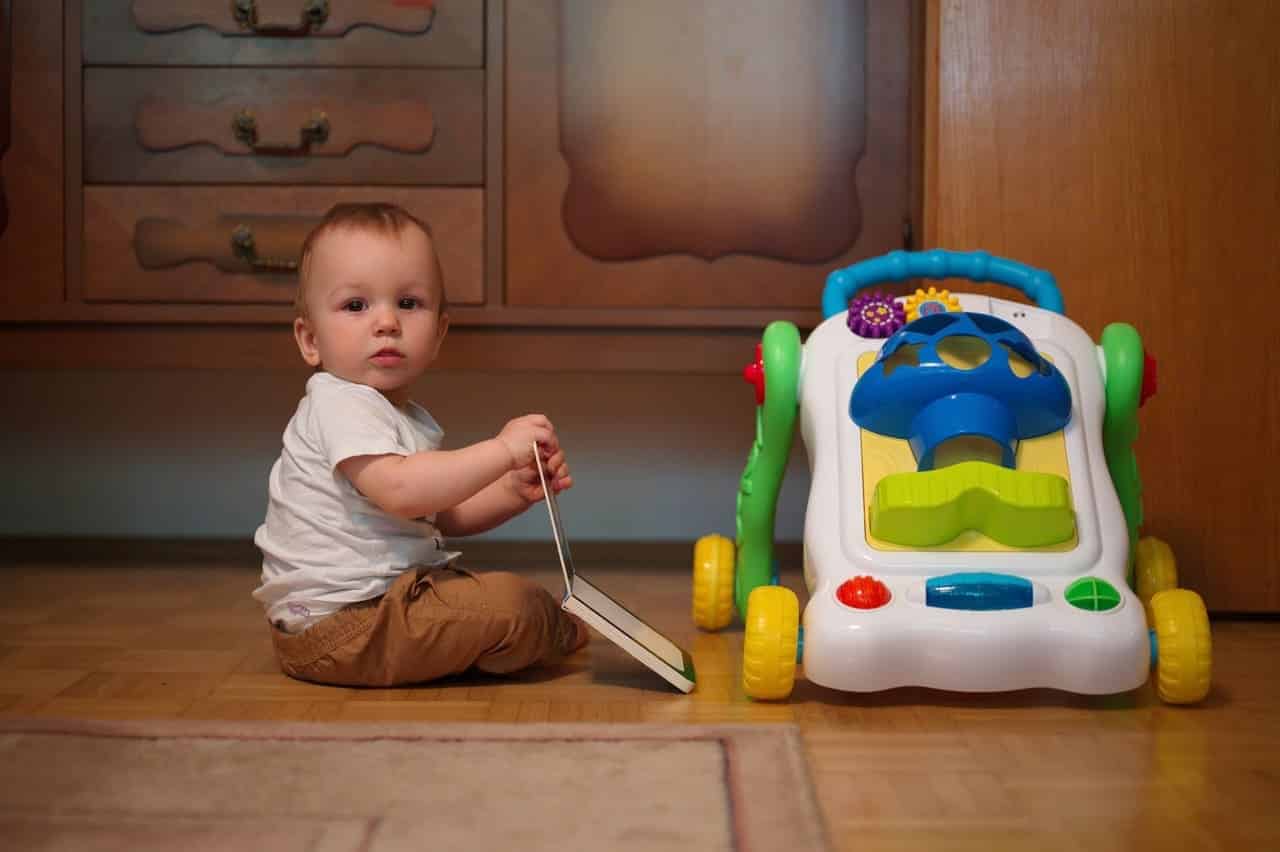 cute little baby sitting on a floor with toy and b 2022 06 21 00 16 58 utc(1)(1)