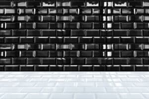 glossy white ceramic brick tile wall and black tile floor