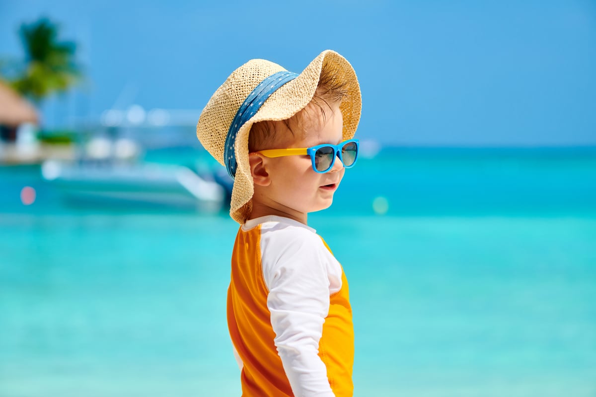 toddler boy with sunglasses on beach