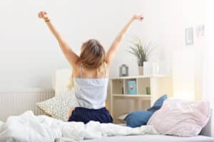 happy woman stretching in the morning
