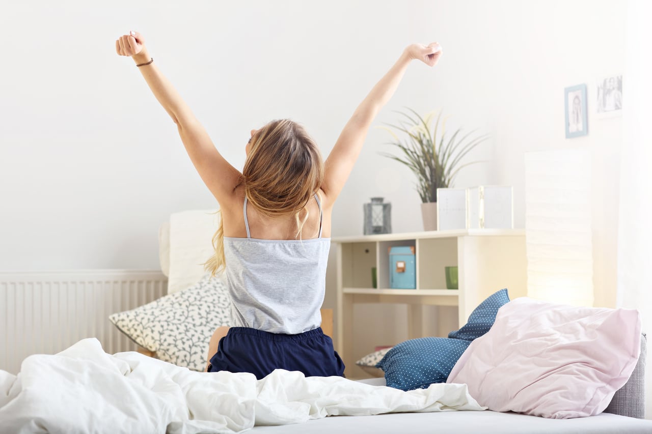happy woman stretching in the morning
