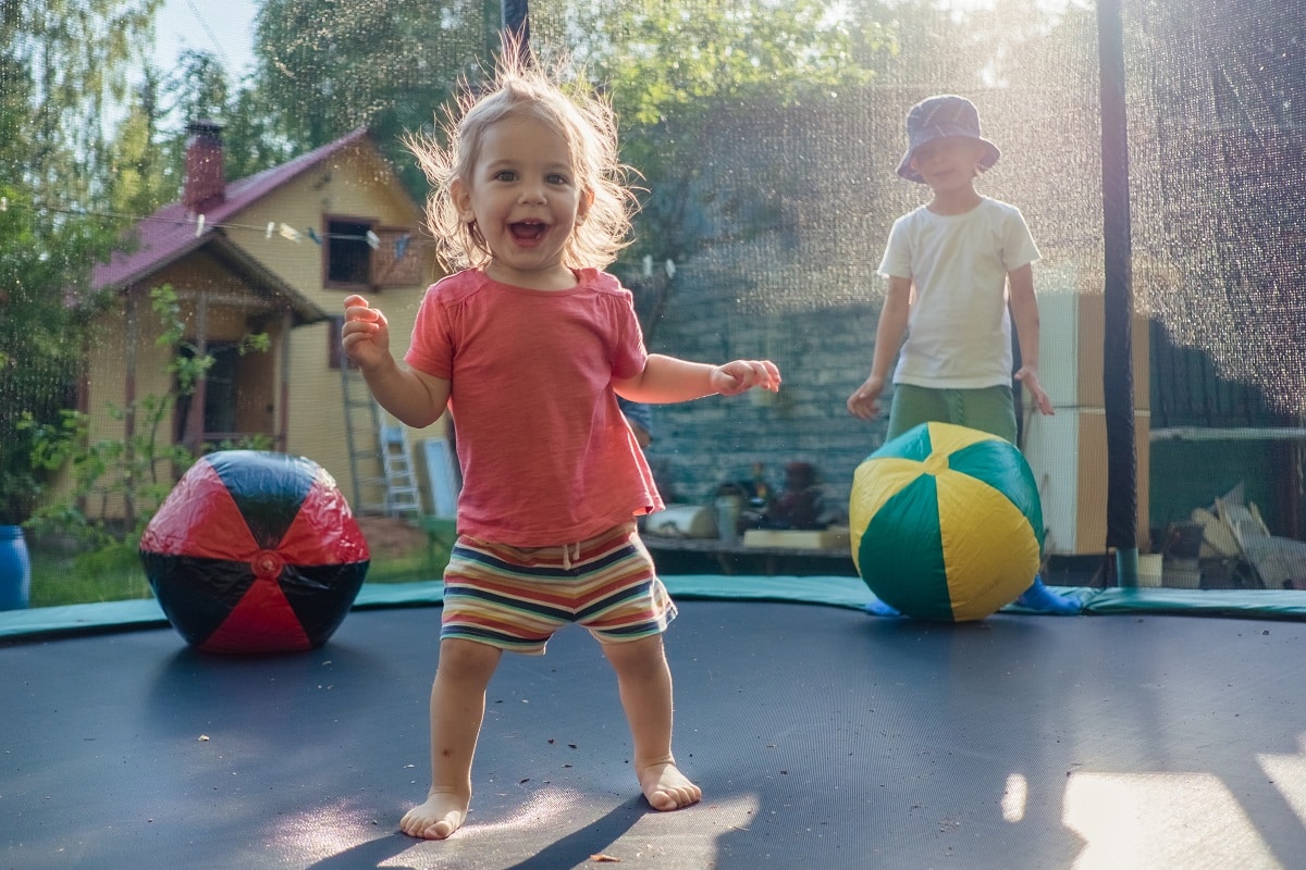 toddler kid jumping on a trampoline 2022 09 13 03 21 13 utc
