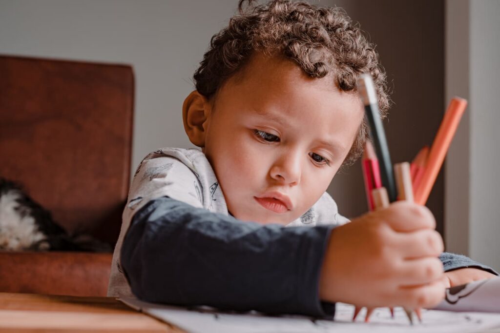 child painting his drawing book with many colors 2022 07 06 23 01 35 utc