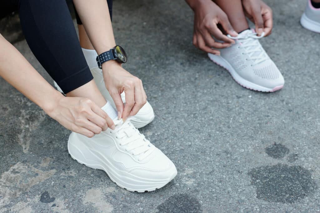 sportswomen tying shoelace 2021 12 09 09 46 45 utc