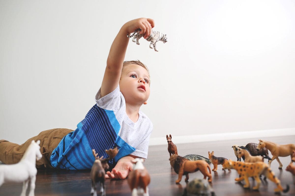 What are the benefits of animal figurines in toddler play?