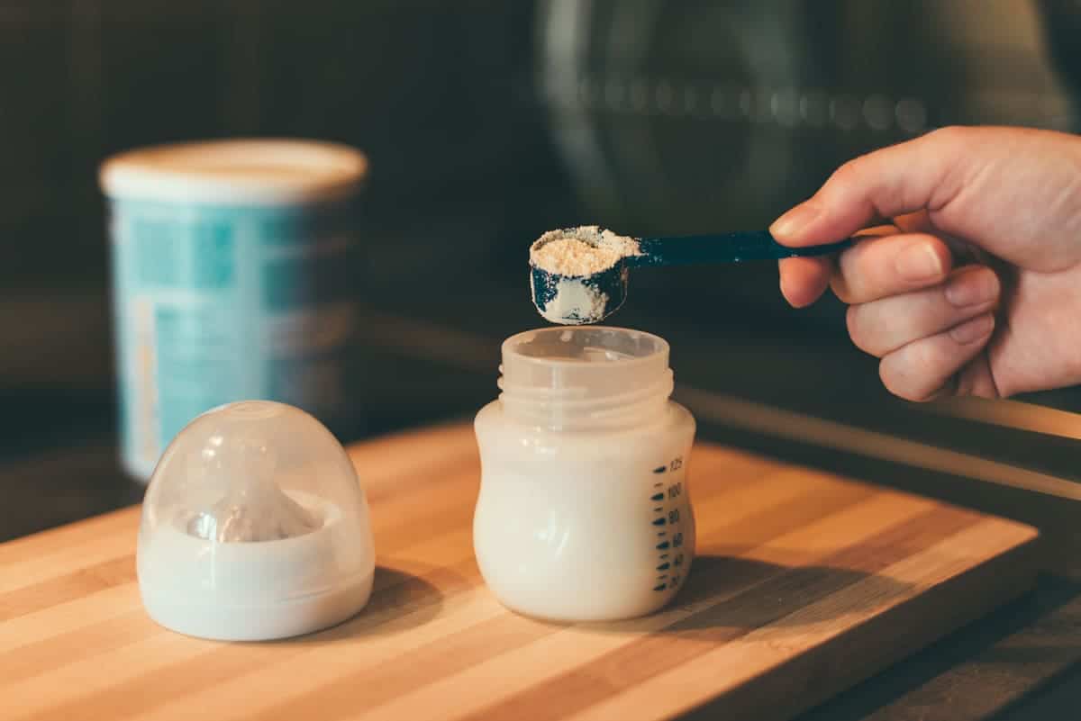 mother making baby formula in milk bottle 2021 08 26 23 02 52 utc(1)(1)