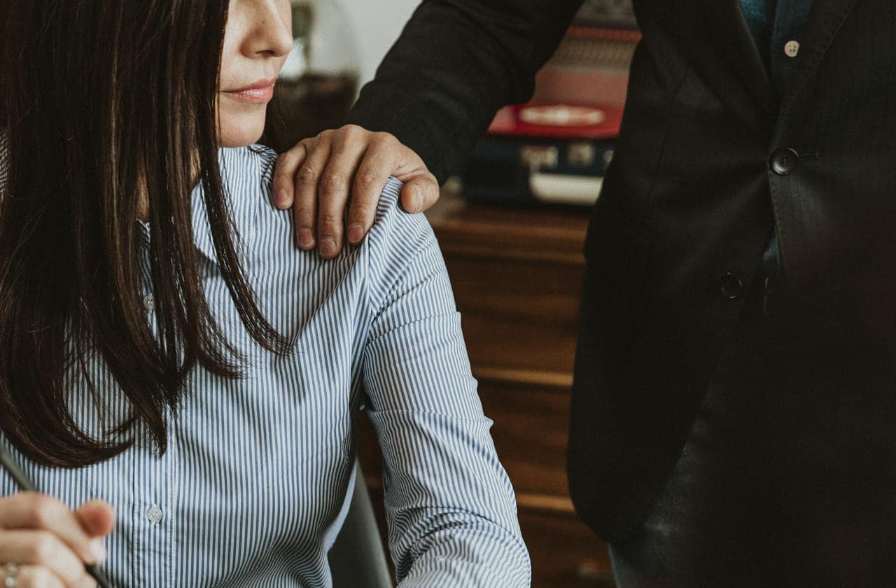 businessman patting a colleague on her shoulder 2022 12 15 23 16 53 utc(1)(1)