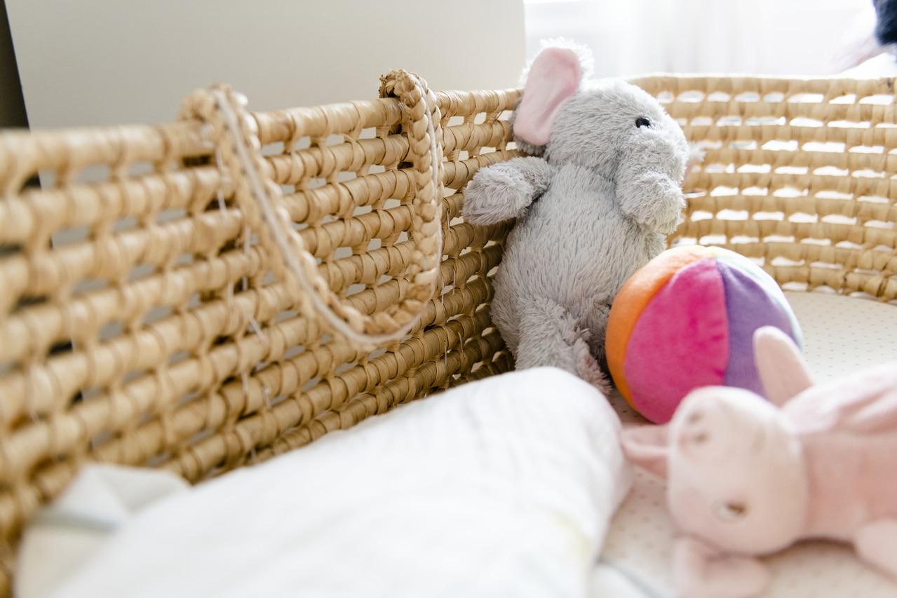 closeup of a baby basket and toys