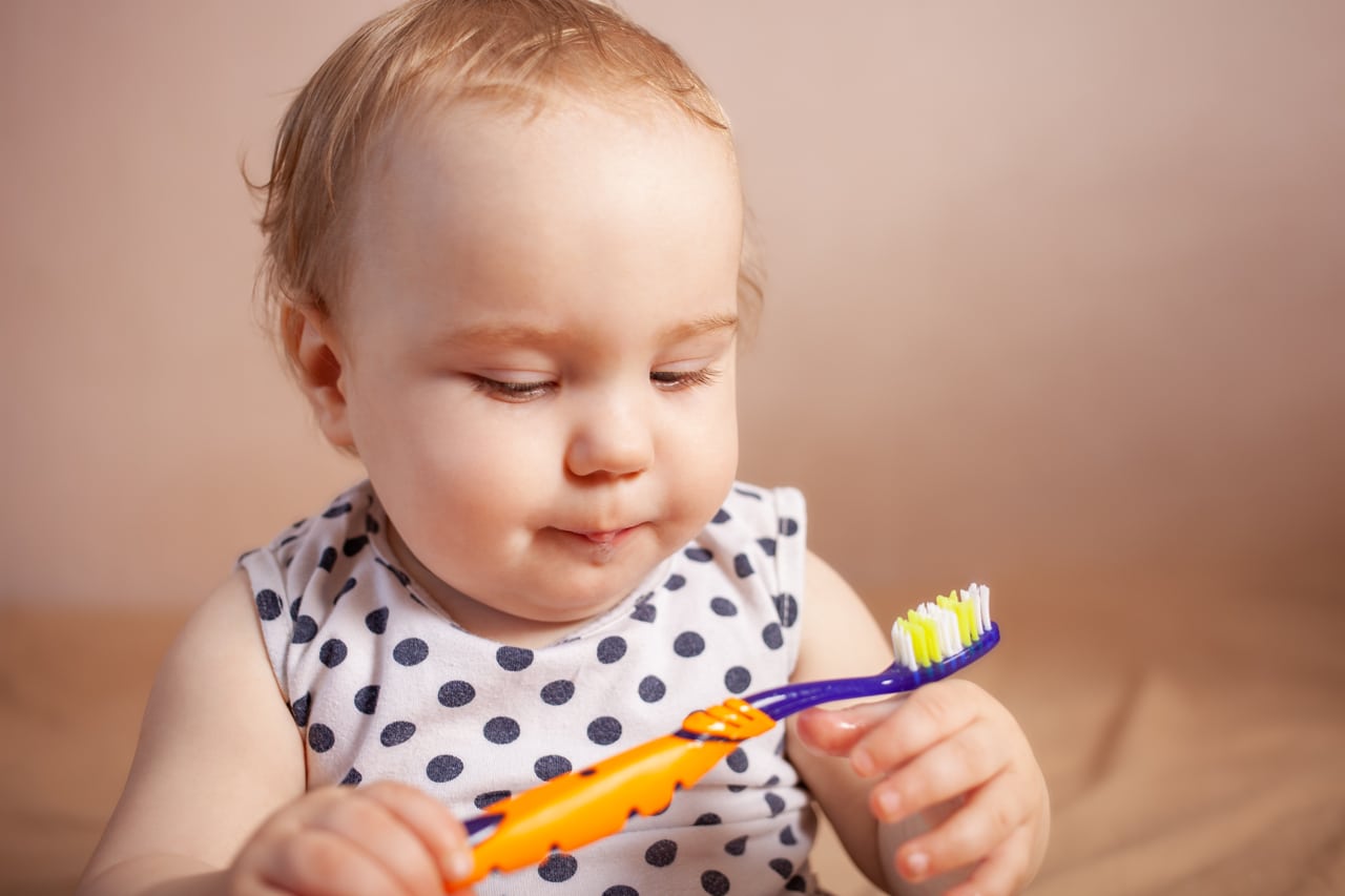 dental hygiene. happy little girl brushing her teeth