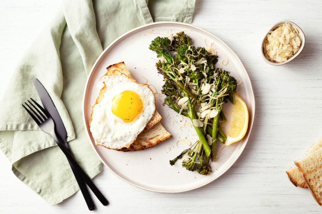 healthy breakfast with broccolini fried egg and t 2022 02 02 03 59 24 utc