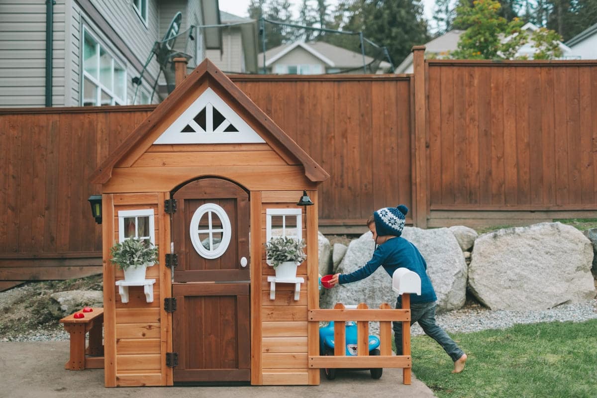 a boy playing in his play house in the back yard 2022 11 15 22 37 36 utc(1)(1)