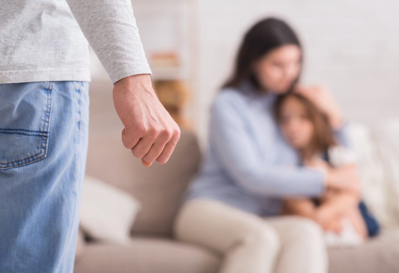 domestic abuse. scared woman and little girl suffering from father's violence