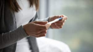female hold in hands pregnancy ovulation test