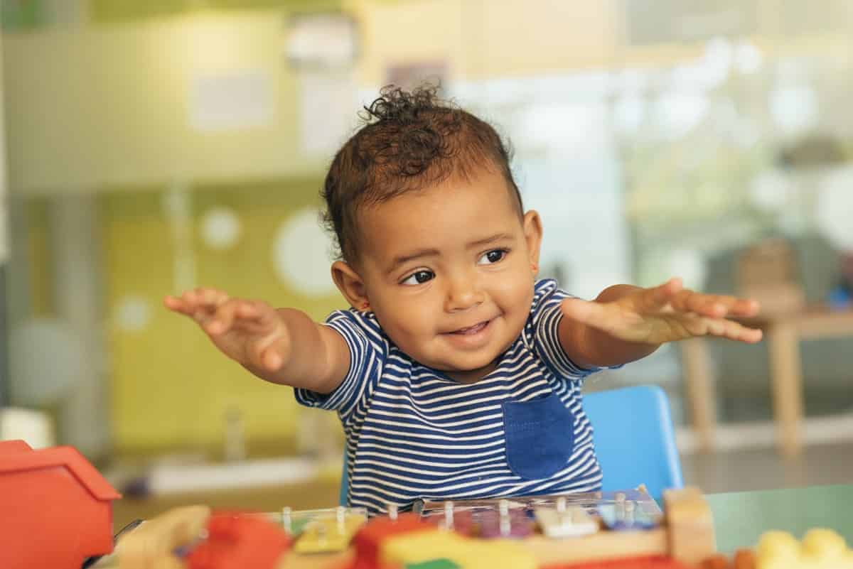 happy baby playing with toy blocks 2021 08 28 03 09 57 utc