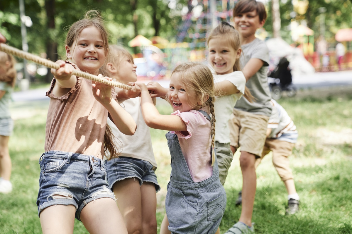 group of kids playing tug of war