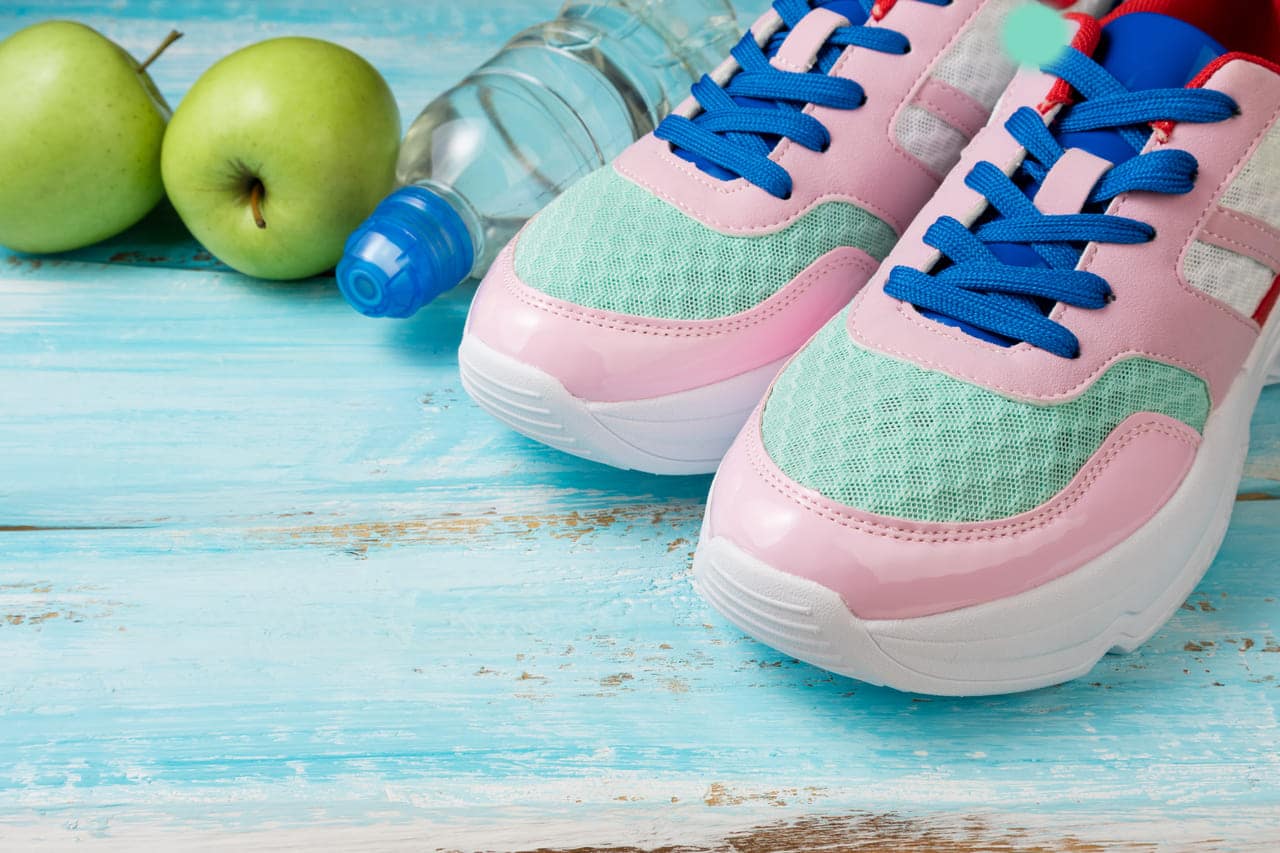 pink sport shoes bottle of water and green apples 2022 12 11 23 59 34 utc11 - How to Make Your Shoes Last a Lifetime