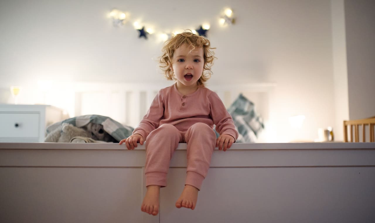 small toddler girl sitting on bed indoors at home 2022 02 02 03 58 54 utc(1)(1)