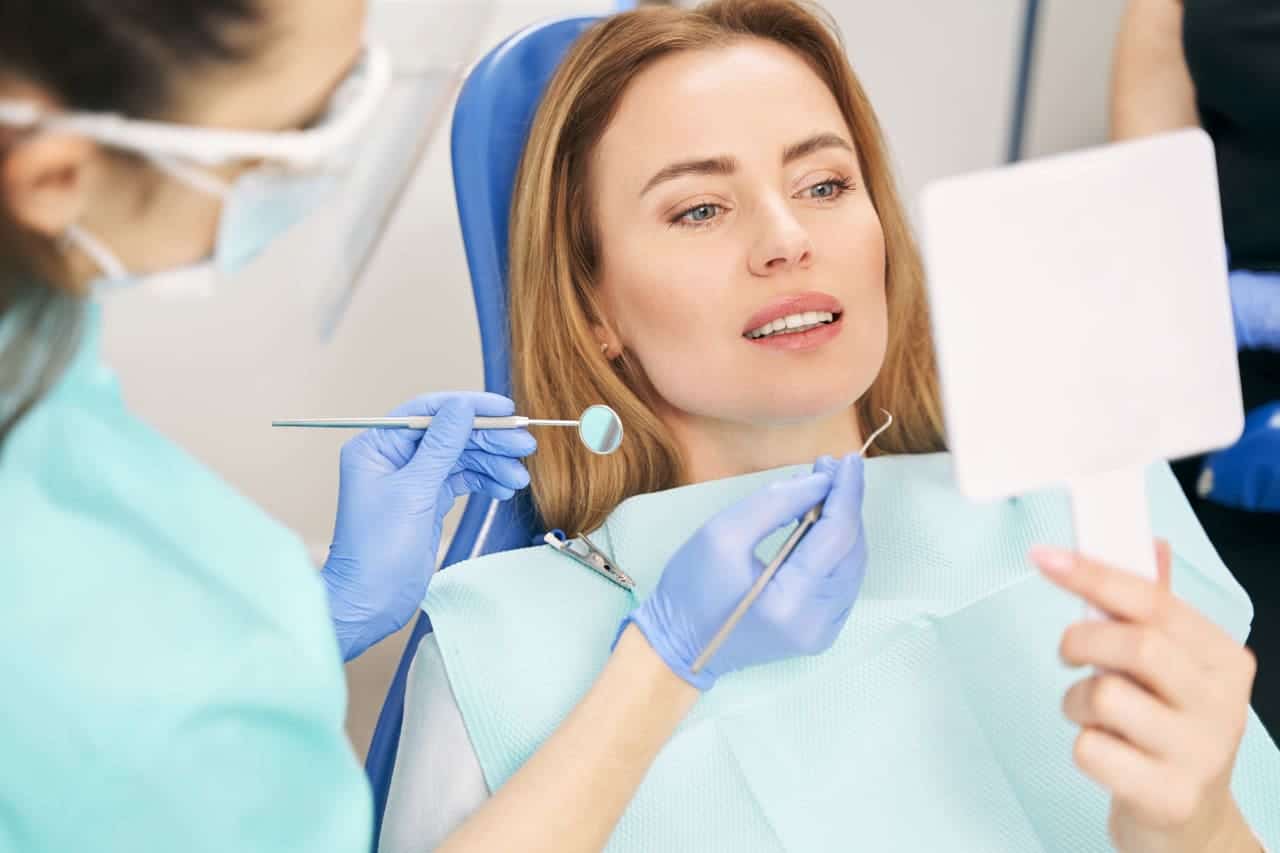 woman having dental examination in stomatology cli 2022 03 25 18 12 58 utc