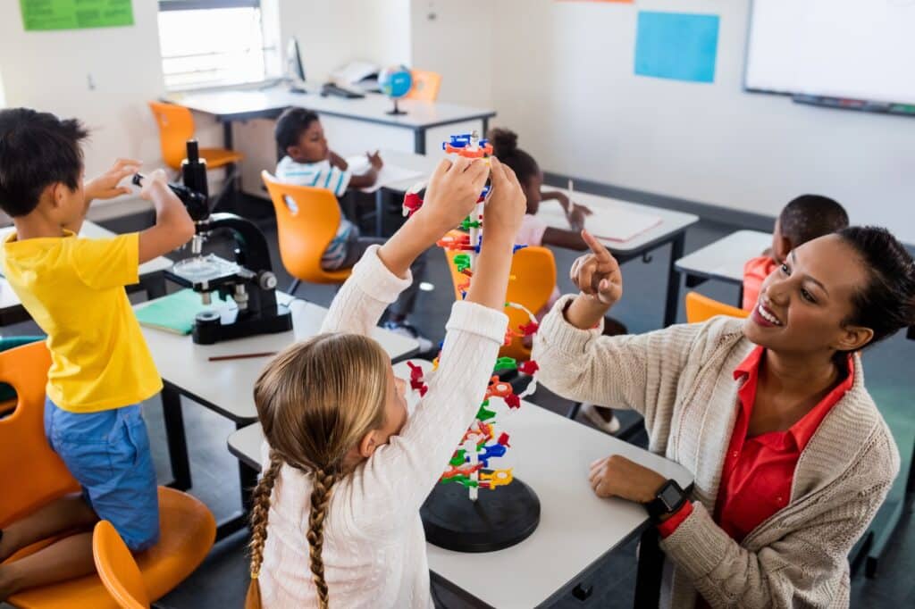 teacher giving lesson to her students