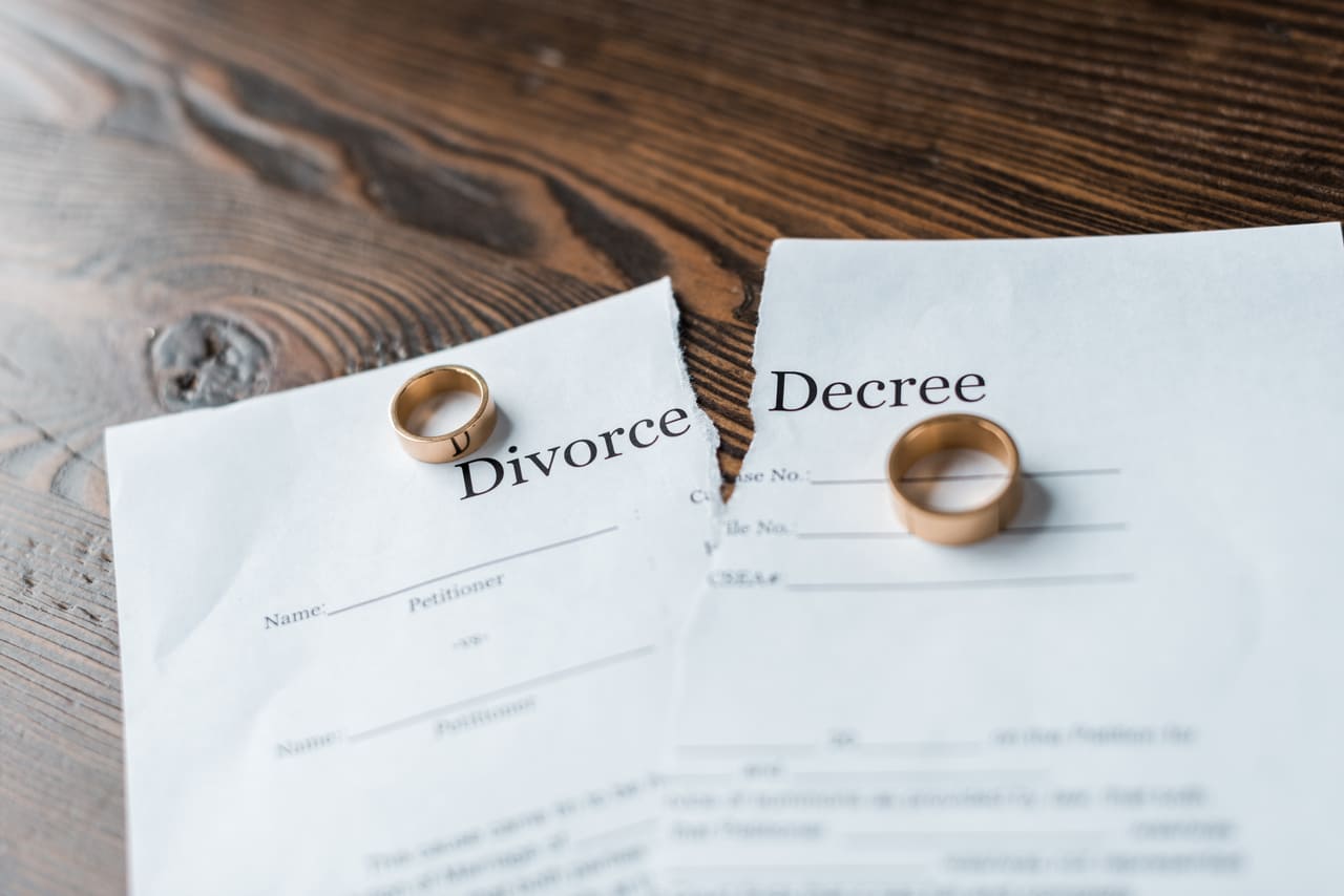 close up shot of teared divorce decree and engagem 2022 12 16 18 22 24 utc