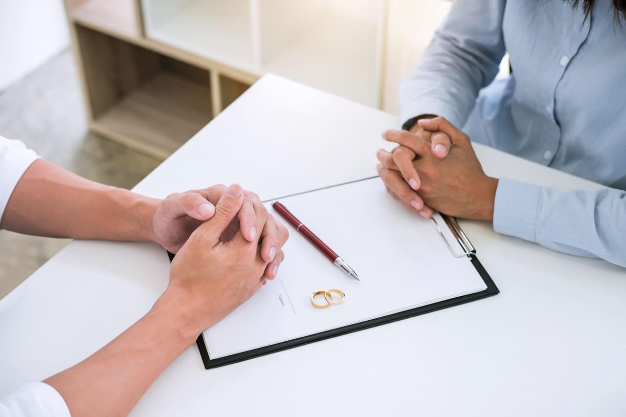 husband and wife are reading divorce agreement and 2022 11 15 15 27 10 utc