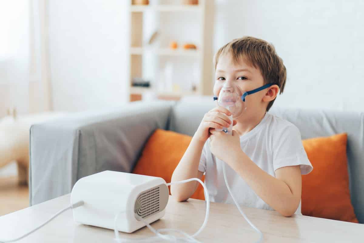 little boy in nebulizer mask breathes medicine 2022 04 14 17 16 04 utc(1)(1)