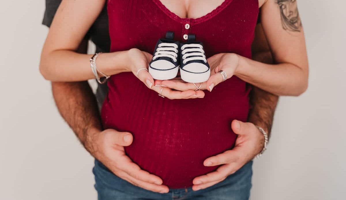 young couple at home hugging happy pregnant woman 2022 04 13 17 53 24 utc
